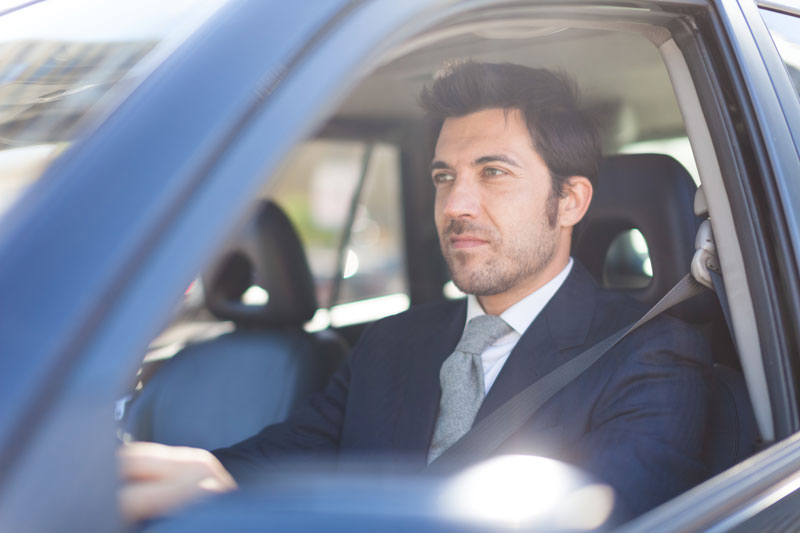 a man driving a car