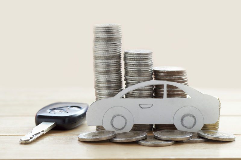 a paper car with coins