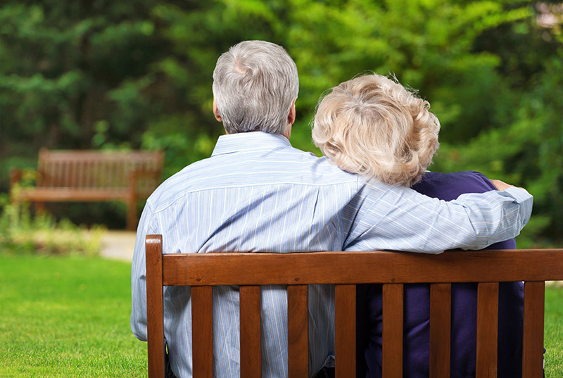 elderly couple on a bench